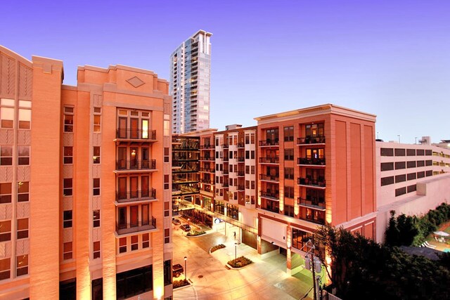 view of outdoor building at dusk