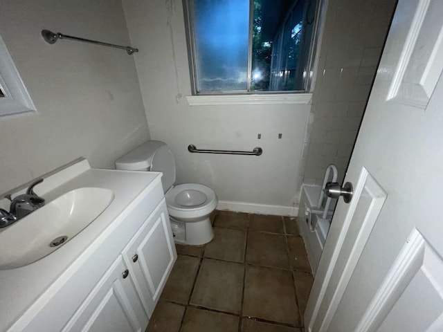 full bathroom with vanity, tiled shower / bath, toilet, and tile patterned flooring