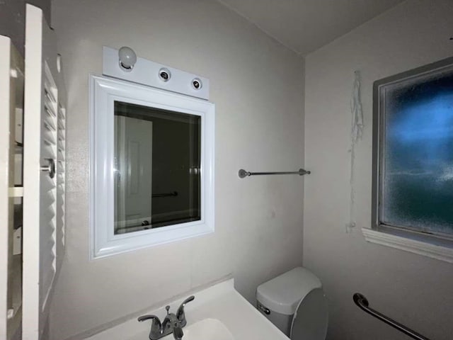 bathroom with toilet and sink