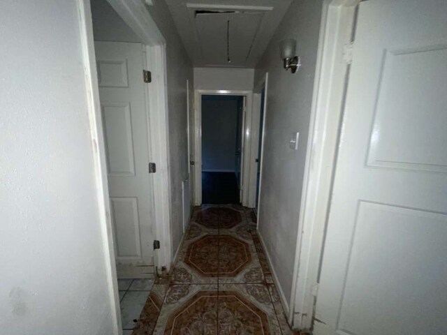 hall with tile patterned flooring