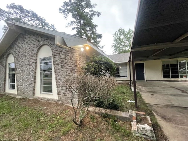 view of side of property featuring a patio