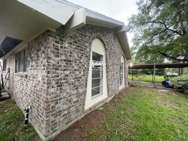 view of home's exterior featuring a carport