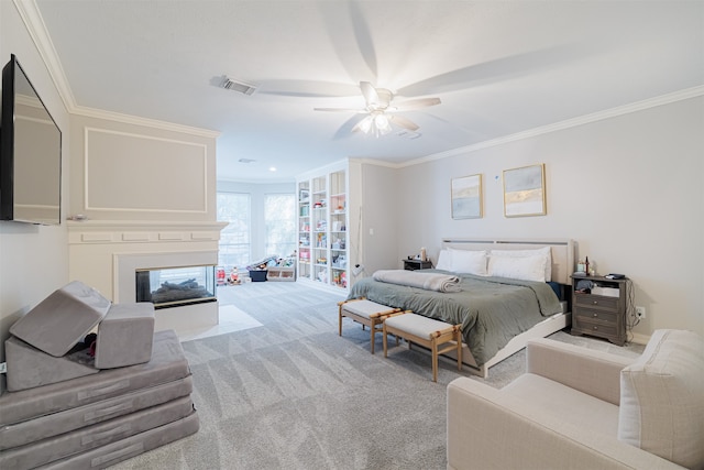 carpeted bedroom featuring a multi sided fireplace, crown molding, access to outside, and ceiling fan