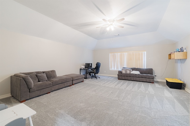 carpeted living room with ceiling fan and lofted ceiling