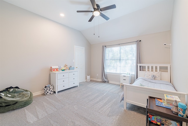 bedroom with light carpet, vaulted ceiling, and ceiling fan