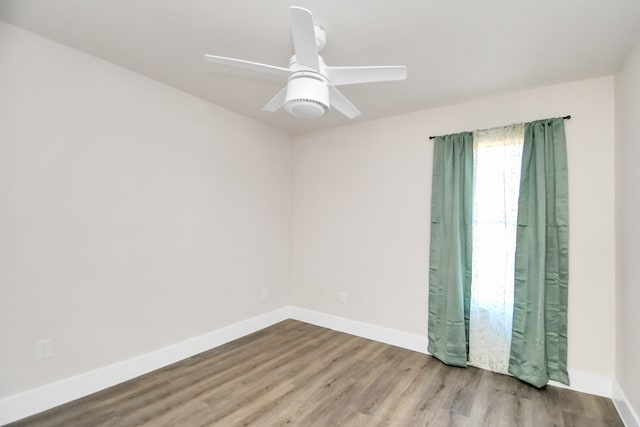 spare room with ceiling fan and light hardwood / wood-style flooring