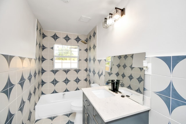 full bathroom featuring vanity, toilet, tile walls, and shower / tub combination