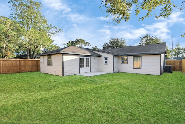 rear view of property with a patio, a lawn, and cooling unit