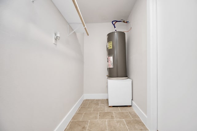 utility room featuring electric water heater