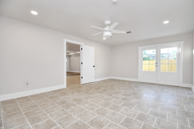 spare room featuring french doors, ceiling fan, and light tile patterned floors