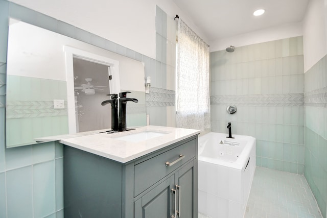 bathroom featuring vanity, separate shower and tub, tile walls, and tile patterned flooring