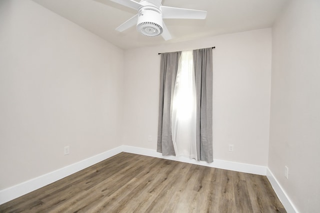 empty room featuring wood-type flooring and ceiling fan