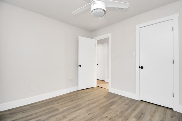 unfurnished bedroom featuring light hardwood / wood-style flooring and ceiling fan