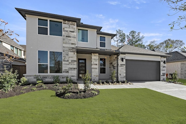 view of front facade with a garage and a front yard