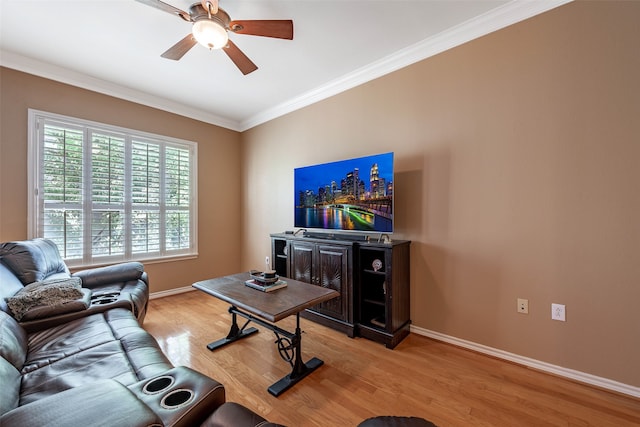 living room with ceiling fan, ornamental molding, and light hardwood / wood-style flooring