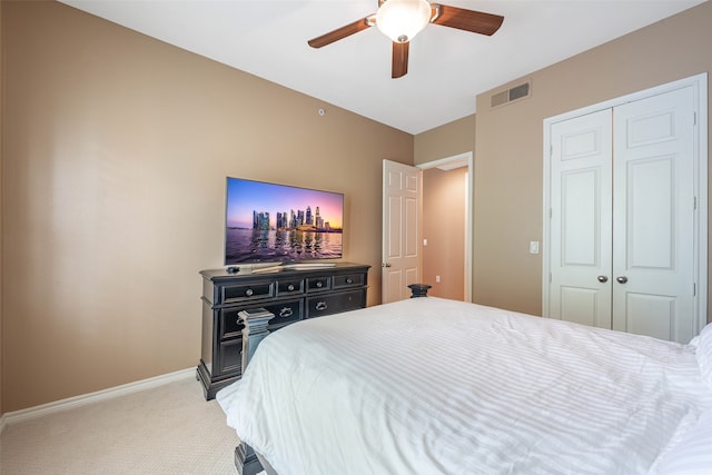 bedroom featuring carpet floors, a closet, and ceiling fan