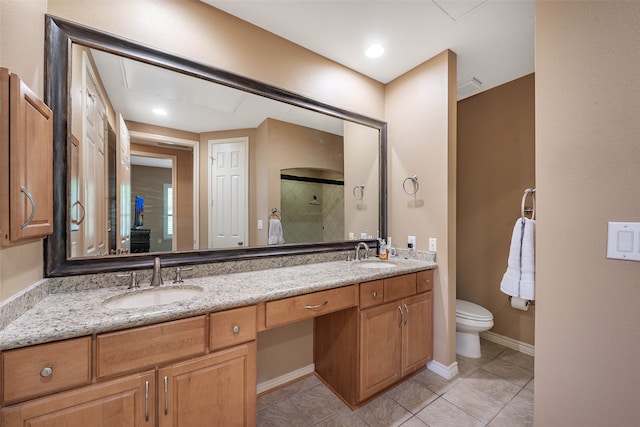 bathroom with vanity, tile patterned floors, toilet, and an enclosed shower