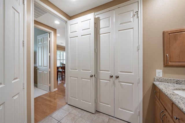 bathroom featuring vanity and hardwood / wood-style floors