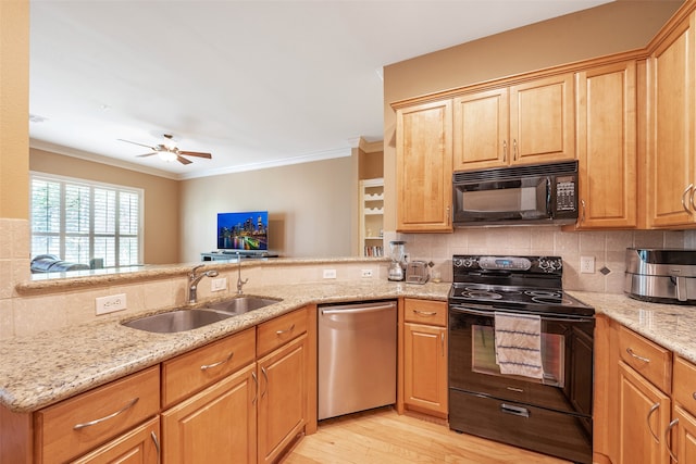 kitchen featuring black appliances, sink, kitchen peninsula, light hardwood / wood-style floors, and crown molding