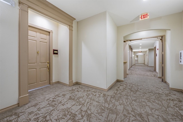 corridor with light colored carpet