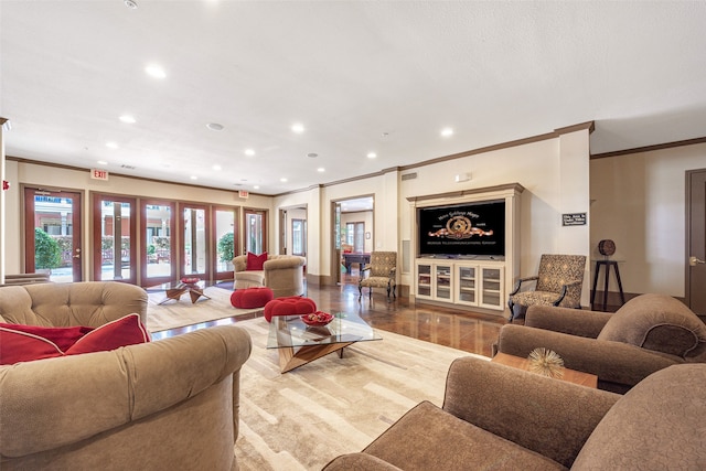 living room with french doors, crown molding, and hardwood / wood-style flooring