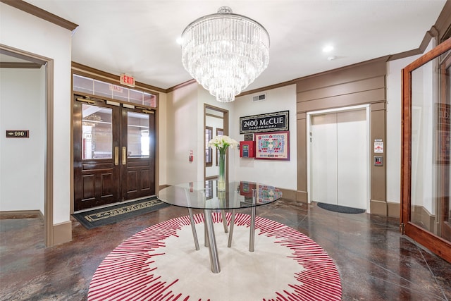 foyer entrance with ornamental molding, a chandelier, and elevator