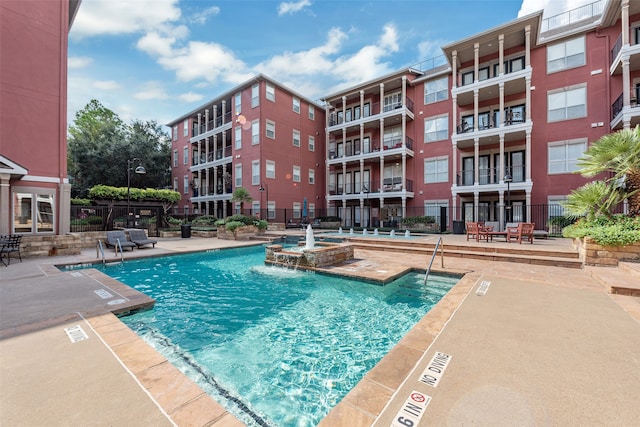 view of pool featuring pool water feature