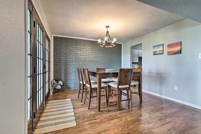 dining area featuring a notable chandelier and dark hardwood / wood-style floors