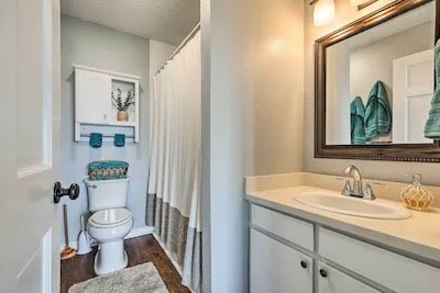 bathroom with vanity, hardwood / wood-style floors, and toilet