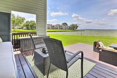 wooden terrace with a lawn