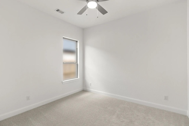 22067 Breakwater Ln, Porter, TX 77365 - unfurnished room with baseboards, a ceiling fan, and light carpet