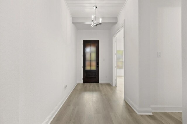22067 Breakwater Ln, Porter, TX 77365 - hall featuring light wood-type flooring, a chandelier, and baseboards
