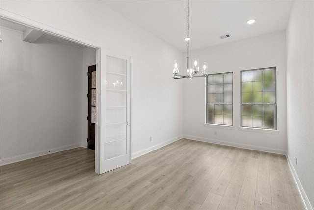 22067 Breakwater Ln, Porter, TX 77365 - empty room featuring a chandelier, light wood finished floors, baseboards, and recessed lighting