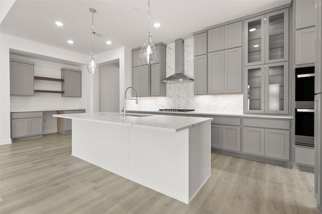 22067 Breakwater Ln, Porter, TX 77365 - kitchen with gray cabinets, wall chimney exhaust hood, open shelves, backsplash, and recessed lighting