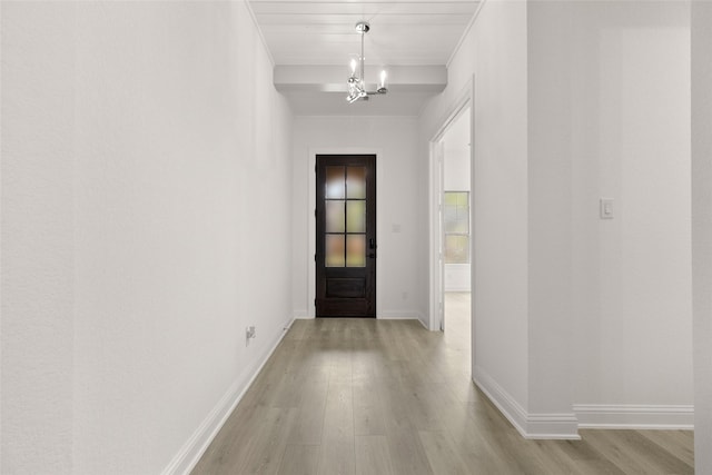 22067 Breakwater Ln, Porter, TX 77365 - hall with light wood finished floors, baseboards, and a chandelier