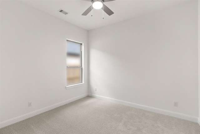 22067 Breakwater Ln, Porter, TX 77365 - spare room featuring baseboards, a ceiling fan, and light carpet