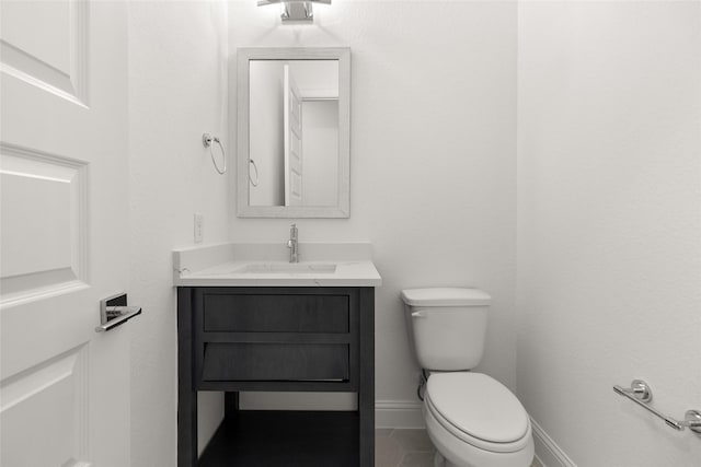 22067 Breakwater Ln, Porter, TX 77365 - bathroom with vanity, toilet, tile patterned flooring, and baseboards