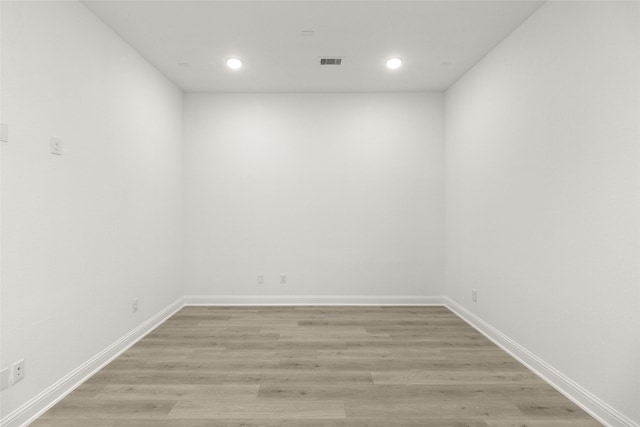 22067 Breakwater Ln, Porter, TX 77365 - empty room featuring recessed lighting, light wood-style floors, and baseboards