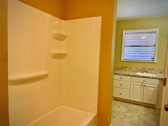 bathroom with vanity and shower / washtub combination