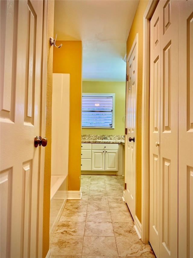 bathroom with tile patterned floors and vanity
