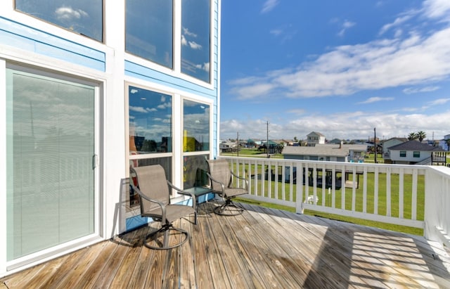 wooden deck with a yard