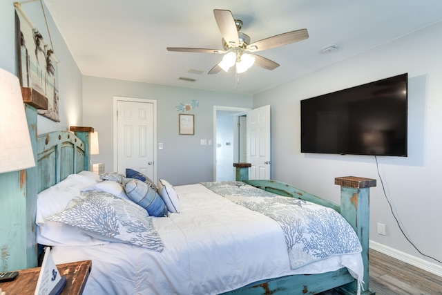 bedroom featuring hardwood / wood-style floors and ceiling fan