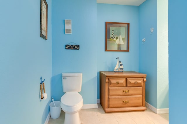 bathroom featuring toilet and tile patterned floors