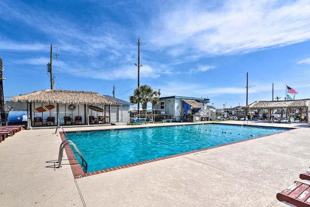 view of swimming pool with a patio area