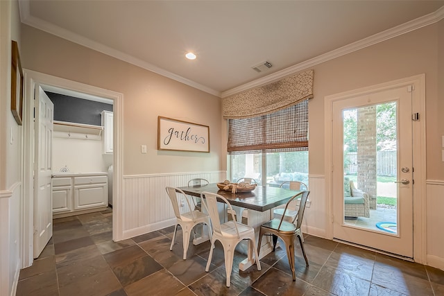 dining space featuring ornamental molding