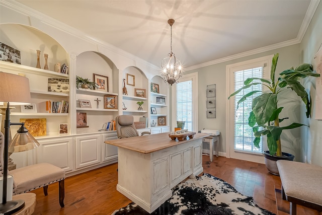 office space with crown molding, light hardwood / wood-style flooring, plenty of natural light, and an inviting chandelier