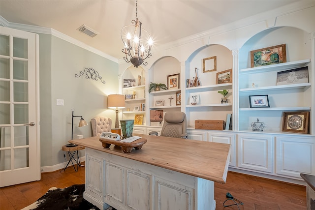 office with a notable chandelier, light wood-type flooring, crown molding, and built in shelves