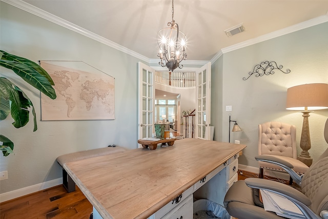 office with a notable chandelier, dark hardwood / wood-style floors, ornamental molding, and french doors