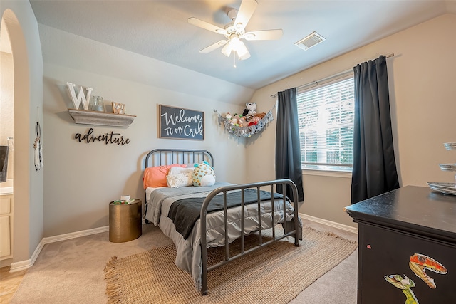 bedroom featuring ceiling fan, light colored carpet, and lofted ceiling