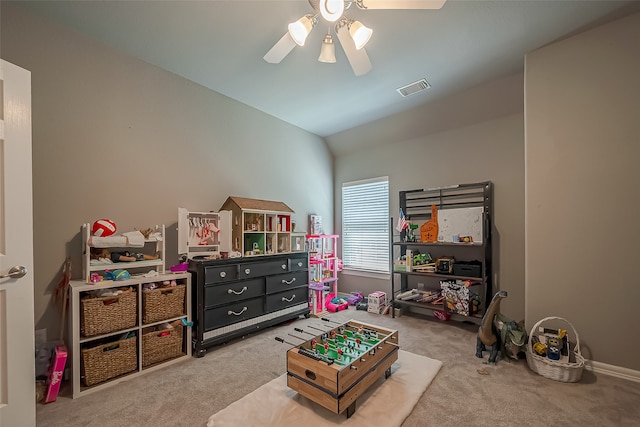 recreation room featuring carpet flooring, ceiling fan, and lofted ceiling